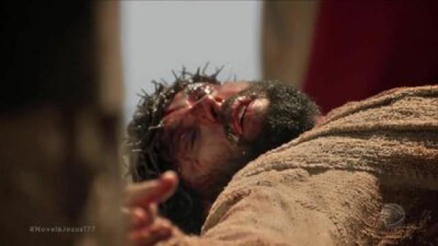 Jesus is scourged as He carries His cross.