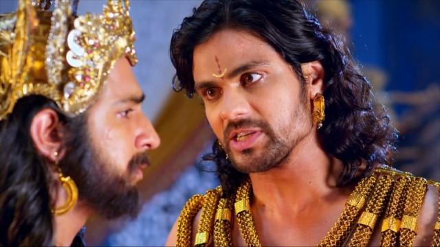 Duryodhana threatens Dhritarashtra